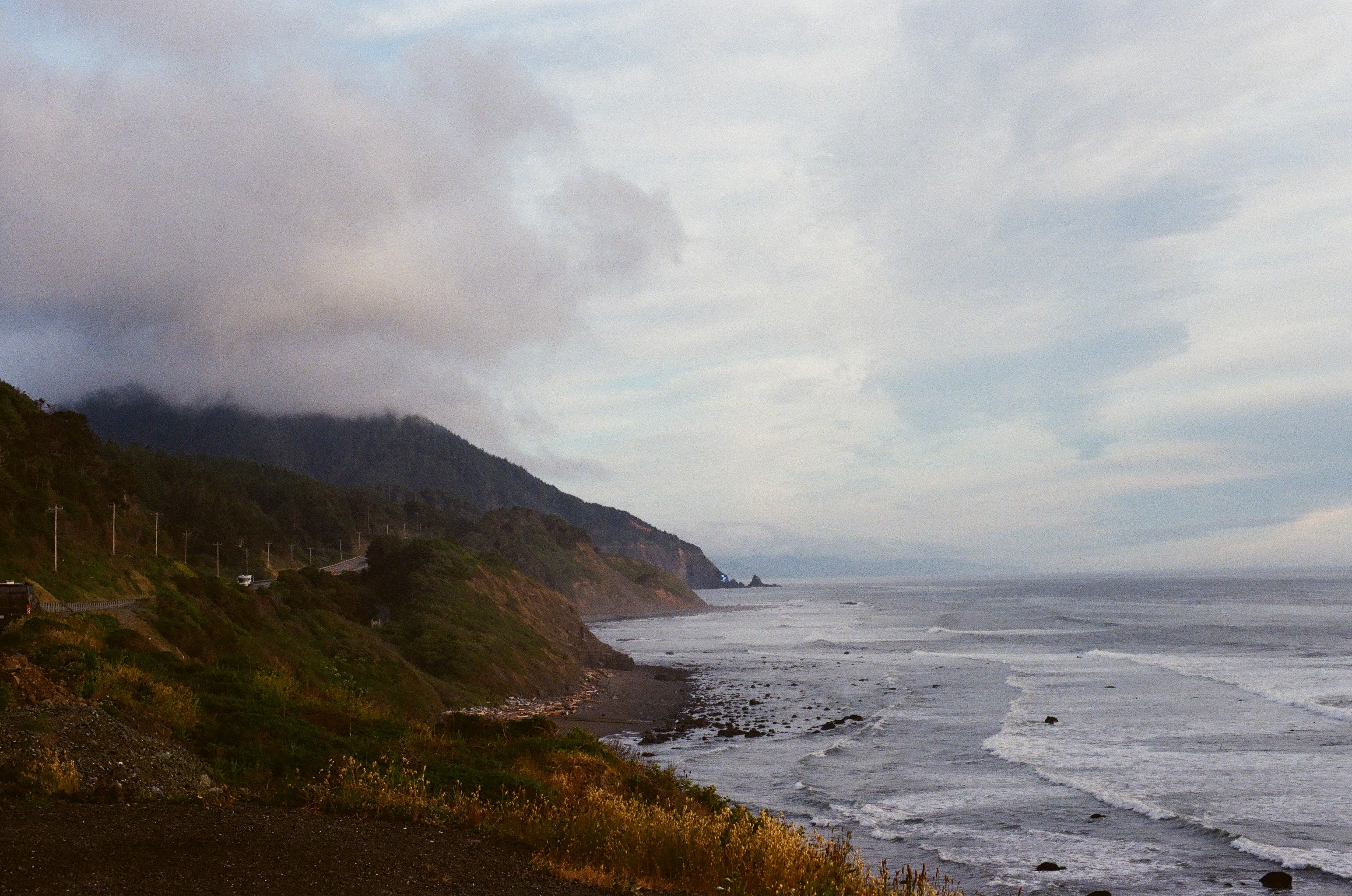 Low cloud cover hanging over the Oregon Coast shoreline.