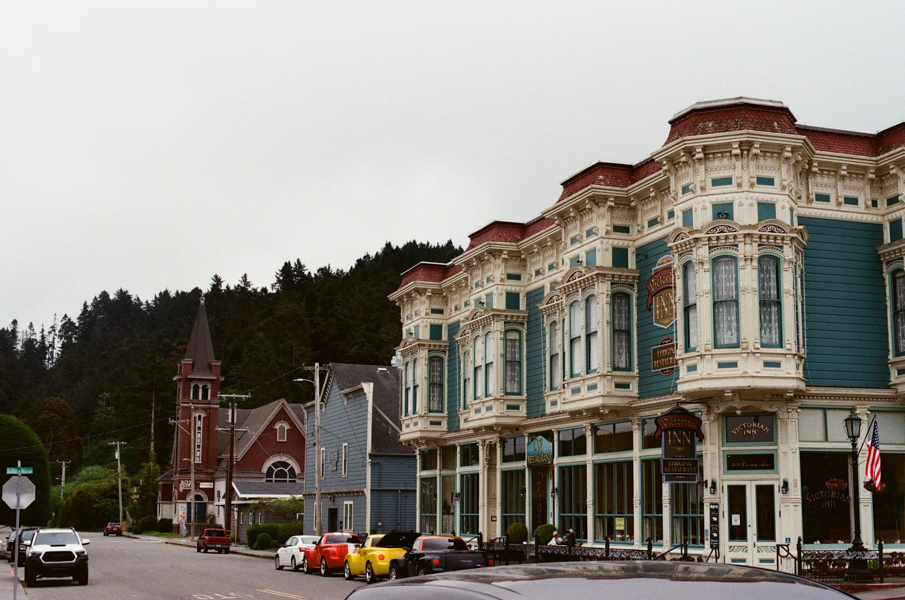 Historic storefronts and church architecture on a small-town street.